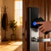 Person unlocking smart door lock with smartphone app control in Accra, Ghana